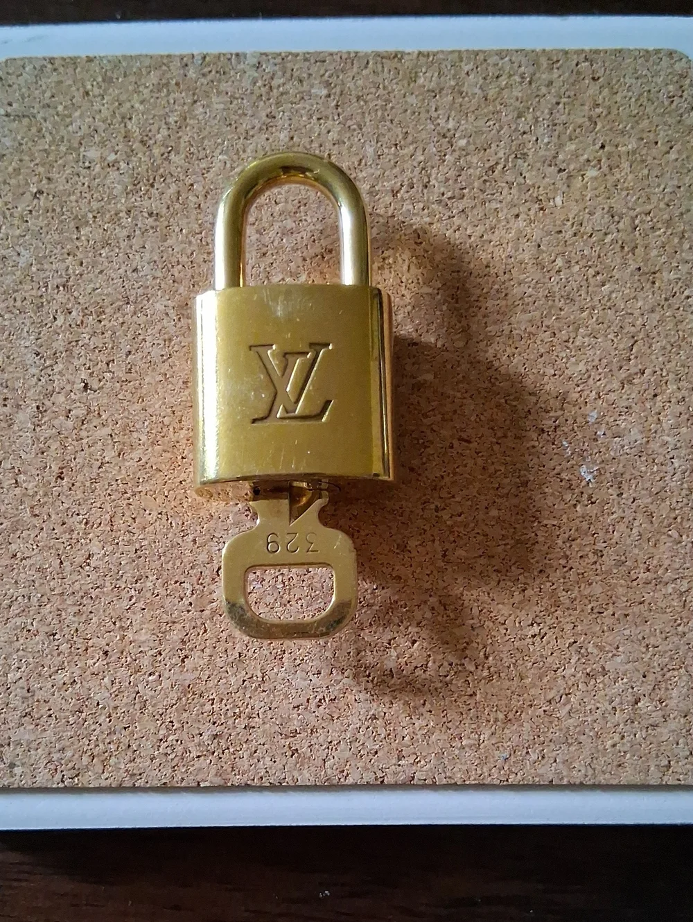 Louis Vuitton Gold Padlock and Key Set Shiny And NEW
